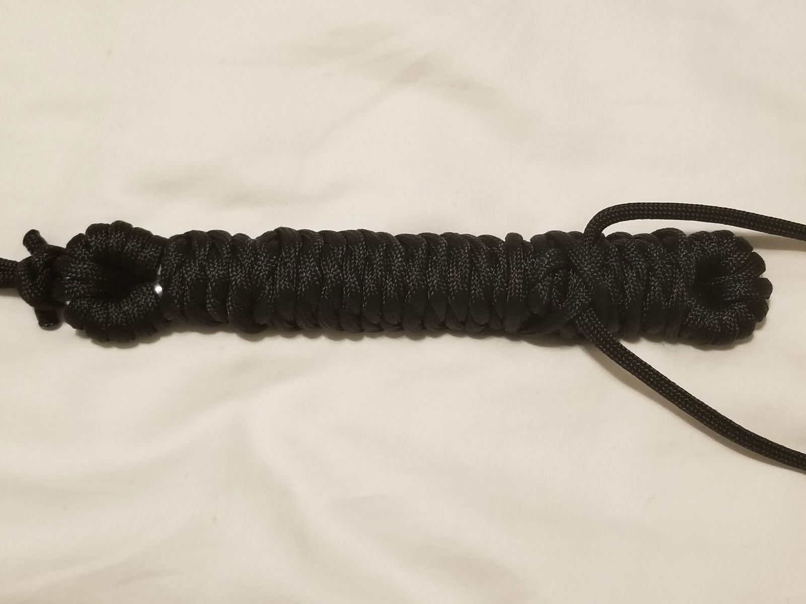 Photo by LemonadeStands with the username @LemonadeStands,  December 18, 2018 at 2:29 AM. The post is about the topic DIY and the text says 'Here's a paracord flogger I made as a Christmas gift for a friend!'