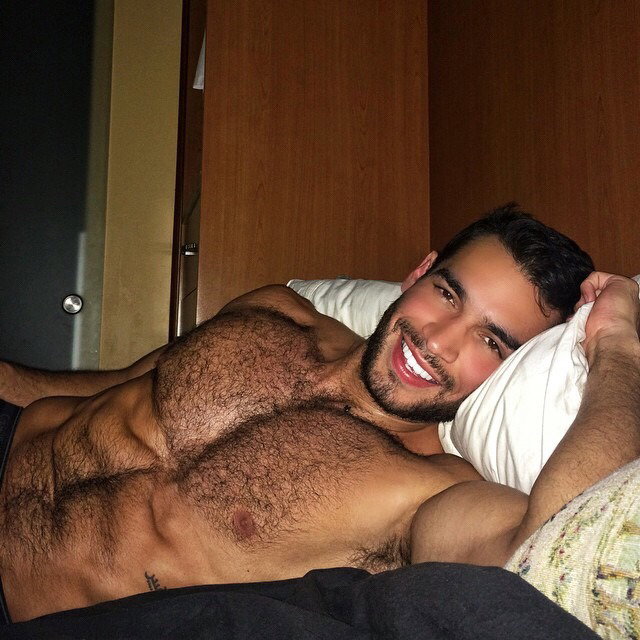 Photo by Charmedguy76 with the username @Charmedguy76, who is a verified user,  December 25, 2018 at 8:47 PM and the text says 'That smile makes me want to lay down beside him and just start running my hands through that hairy chest and kiss that gorgeous mouth!'