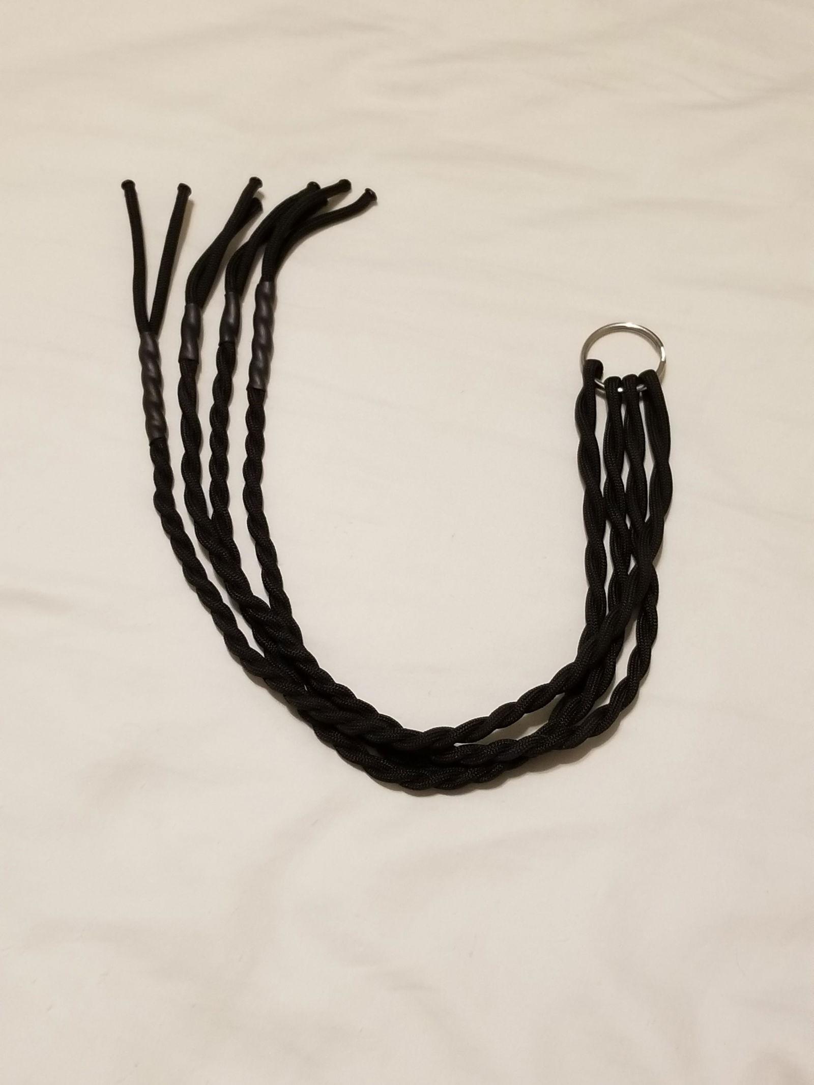 Photo by LemonadeStands with the username @LemonadeStands,  December 18, 2018 at 2:29 AM. The post is about the topic DIY and the text says 'Here's a paracord flogger I made as a Christmas gift for a friend!'