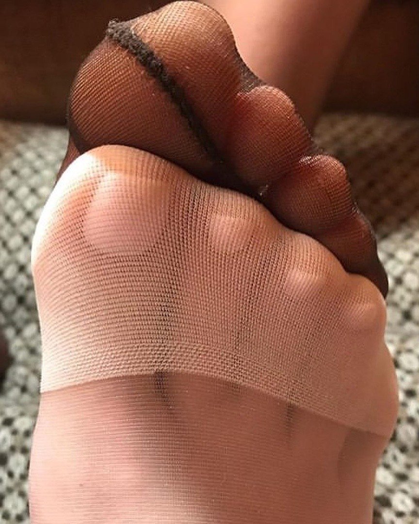 Photo by Ella Ford with the username @EllaFordBooks, who is a verified user,  December 15, 2019 at 2:30 PM. The post is about the topic Girls Who Like Girls Who Like Feet and the text says 'In moments of indulgence, I call to mind those first nervous touches. Her toes and mine, brushing together across the couch, slippery in nylon, accidental at first but not for long. Ecstasy had its genesis in that brief contact, and its memory burns like..'