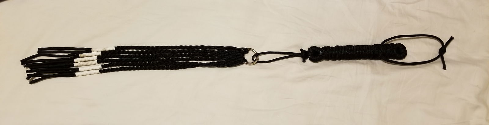 Photo by LemonadeStands with the username @LemonadeStands,  December 18, 2018 at 2:29 AM. The post is about the topic DIY and the text says 'Here's a paracord flogger I made as a Christmas gift for a friend!'