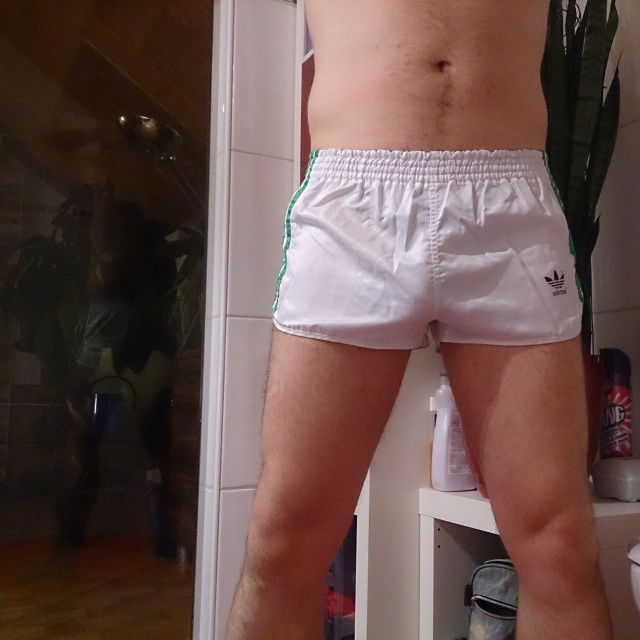 Gay in shiny shorts 