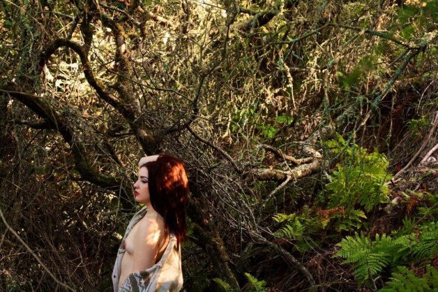 Album by Jade Lust with the username @brattylilnympho, who is a star user,  April 23, 2021 at 8:56 PM and the text says 'I really enjoy being vulnerable and naked in the forest. The risk of not knowing who may stumble upon me and what they’ll do is riveting 😅😇😈 #exhibitionist #outdoors #natureslut allmylinks.com/jadelustx'