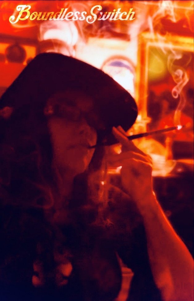 Photo by SwitchForHer with the username @SwitchForHer,  March 5, 2022 at 5:43 PM. The post is about the topic SMOKING WOMEN LOVE and the text says '#boundlessswitch, #smoking, #mistress, #cigaretteholder, #hat'