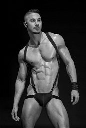 Photo by Schadenfreude with the username @Schadenfreude,  November 27, 2018 at 9:12 PM and the text says '#male  #beefcake  #rex  #harness  #hot  #standing  #spine  #curve  #shoulders'