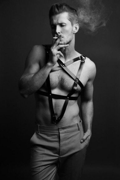 Photo by Schadenfreude with the username @Schadenfreude,  February 7, 2016 at 5:38 PM and the text says 'ad2deep:

# Krzysztof Wyzynski  Jeremi model.
 #Male  #Hail  #satan  #pentagram  #leather  #harness  #leather  #harness  #cigarette  #beefcake'