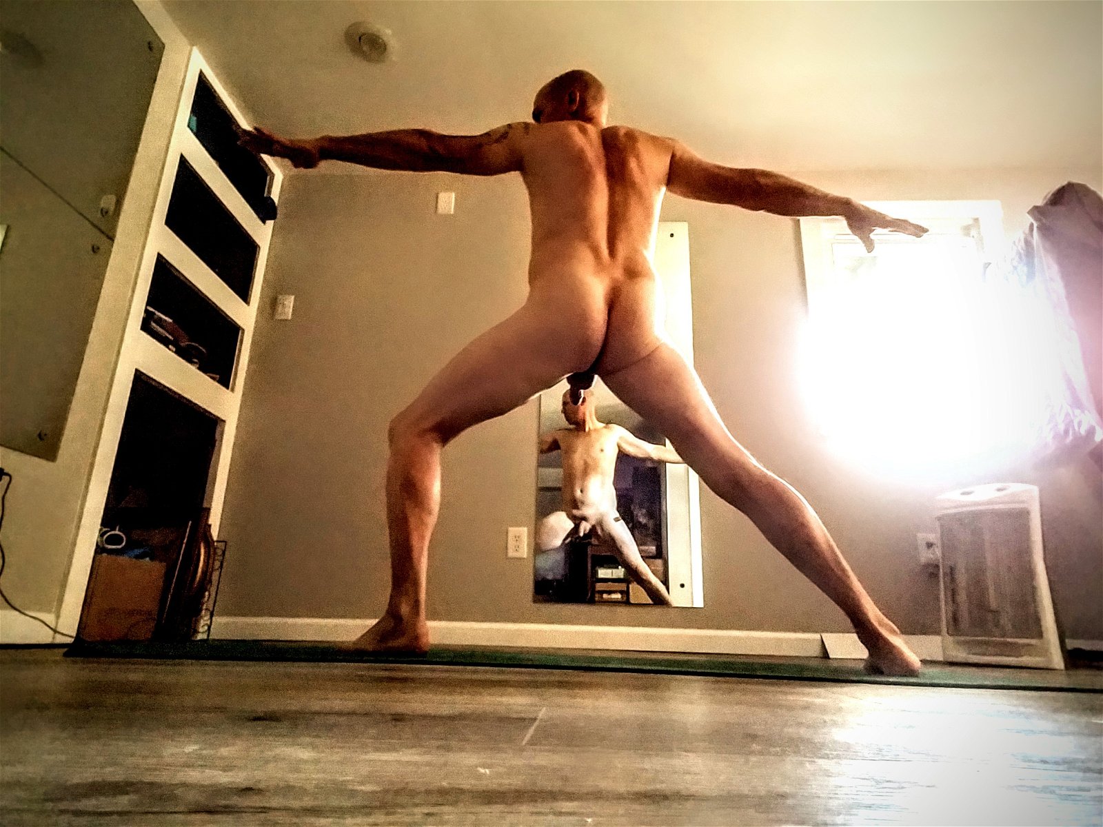 Photo by ArtOfNakedYoga with the username @ArtOfNakedYoga, who is a verified user,  December 12, 2018 at 1:18 PM. The post is about the topic YogaNude and the text says '#yoga #me #nudeyoga #nakedyoga #warrior II'