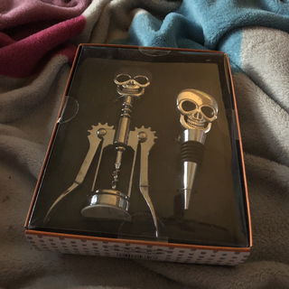 Photo by Queen Luna with the username @BJQueenLuna, who is a star user,  December 26, 2019 at 2:49 PM and the text says 'I even got a Skull Wine Gift Set'