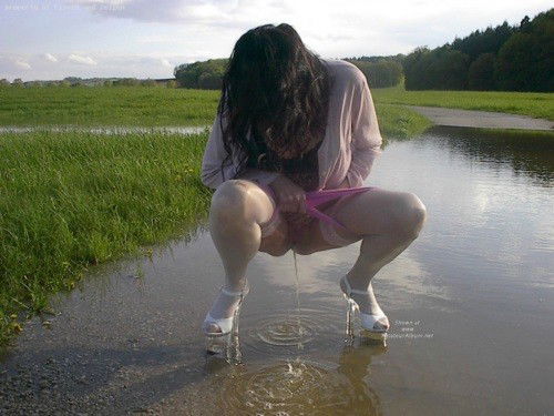 Photo by urodisco with the username @urodisco,  March 24, 2013 at 9:39 PM and the text says 'warmthandwetness:


The heels give this a surreal feel. The ripples in the water, the reflection and the shadows make it perfect.
 #pee  #piss  #pissing  #outdoors  #heels  #watersports  #reflection  #ripples  #water  #meadow  #porn  #nsfw'