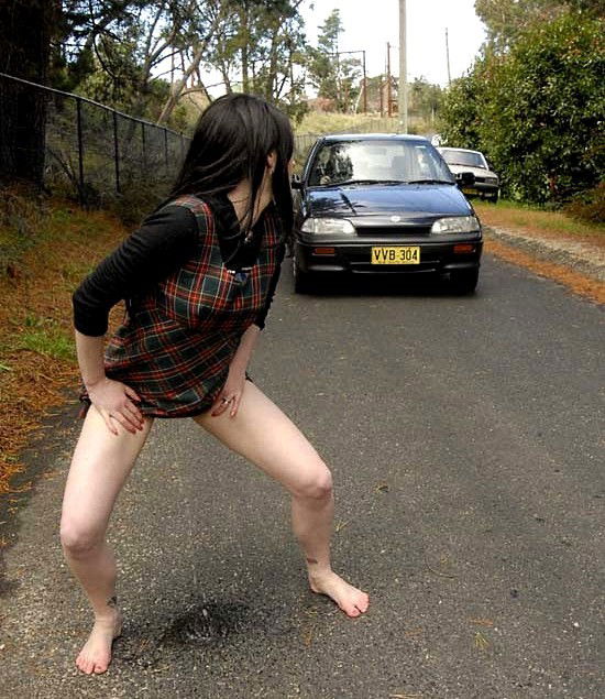 Photo by urodisco with the username @urodisco,  August 6, 2014 at 12:01 AM and the text says 'Hitchhiking, UroDisco style. #pee  #piss  #pissing  #hitchhiking  #public  #road'