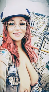 Album by Hitgirly with the username @Hitgirly, who is a verified user,  August 20, 2024 at 4:55 PM. The post is about the topic She loves to be naked at work! and the text says 'How would you like to be on her crew?😜'