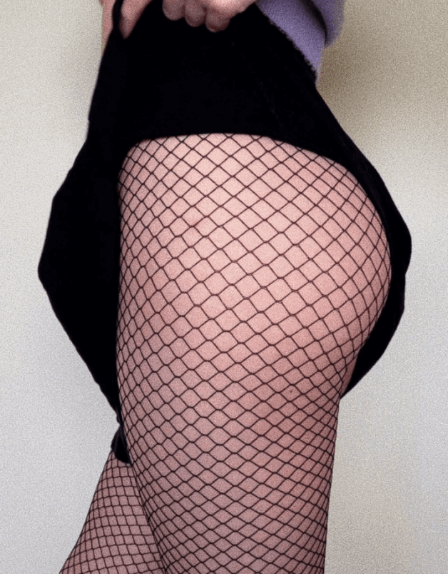 Photo by Lola's Kinks with the username @lolaskinks, who is a verified user,  September 2, 2021 at 9:21 PM. The post is about the topic Fishnet Clothing and the text says 'Have I already mentioned that I like wearing skirts and fishnets? 😇'