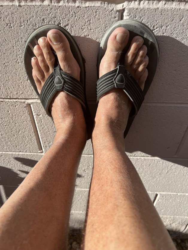 Photo by Desertguy with the username @Desertguy, who is a verified user,  June 6, 2023 at 3:55 PM. The post is about the topic Guys in Flip Flops and the text says 'Flipflops feet'