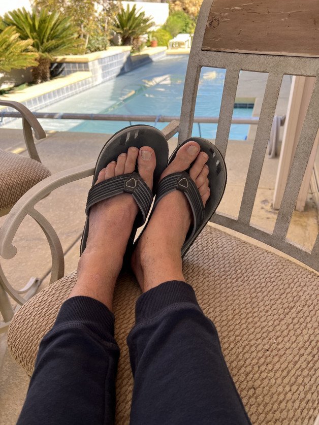 Photo by Desertguy with the username @Desertguy, who is a verified user,  April 10, 2023 at 6:06 PM. The post is about the topic Male feet, socks and jocks and the text says 'Feet and flip flops'