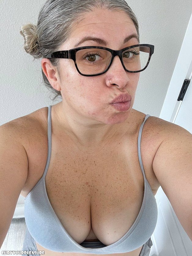 Photo by Curvy4urpleasure with the username @Curvy4urpleasure, who is a star user,  January 9, 2023 at 4:23 PM. The post is about the topic MILF and the text says 'Morning, a kiss from mommy to start the week right! #Mommy #Mom #Milf #Cleavage #Glasses #sexy #nerdy #nsfwtw #nsfwtwt'