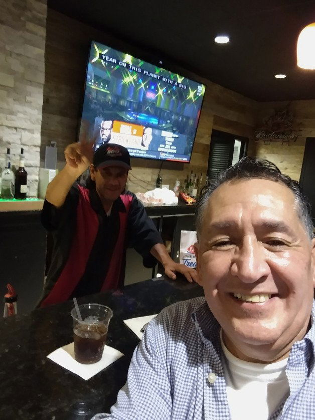 Photo by DirtyE with the username @DirtyE,  November 1, 2021 at 6:09 AM and the text says 'Yep that's beyond that I have inside the blue shirt have some drinks with the old bartender friend of mine'