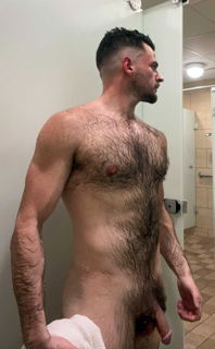 Shared Photo by BE with the username @BE,  June 28, 2024 at 2:23 AM. The post is about the topic Men's Lockeroom and the text says 'Showing off that big hairy bush and schlong in the gym locker room'