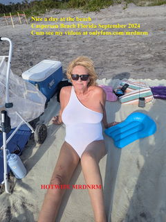 Album by Hotwife MRDNRM with the username @mrdnrm, who is a star user,  September 17, 2024 at 4:36 PM and the text says 'HOTWIFE MRDNRM, A Cougar on the beach, will you help me out with my sunscreen?  onlyfans.com/mrdnrm'