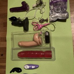 Photo by Betsy3.0 with the username @Betsy3.0, who is a verified user,  April 7, 2022 at 8:25 PM. The post is about the topic Female Masturbation and the text says 'because this has come up several times in conversations...here is most of the toy collection! And yes, that is an un-opened bag of assorted butt plugs 😂...it came free with an order 🤷‍♀️. theres a few more, you get it the idea! ❤️💜B'