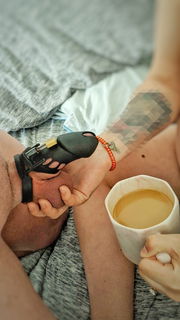 Photo by pashion8couple with the username @pashion8couple,  April 10, 2022 at 2:57 PM. The post is about the topic Cuckold and the text says 'Morning Coffee and a Inspection. #cuck #cuckold #caged'