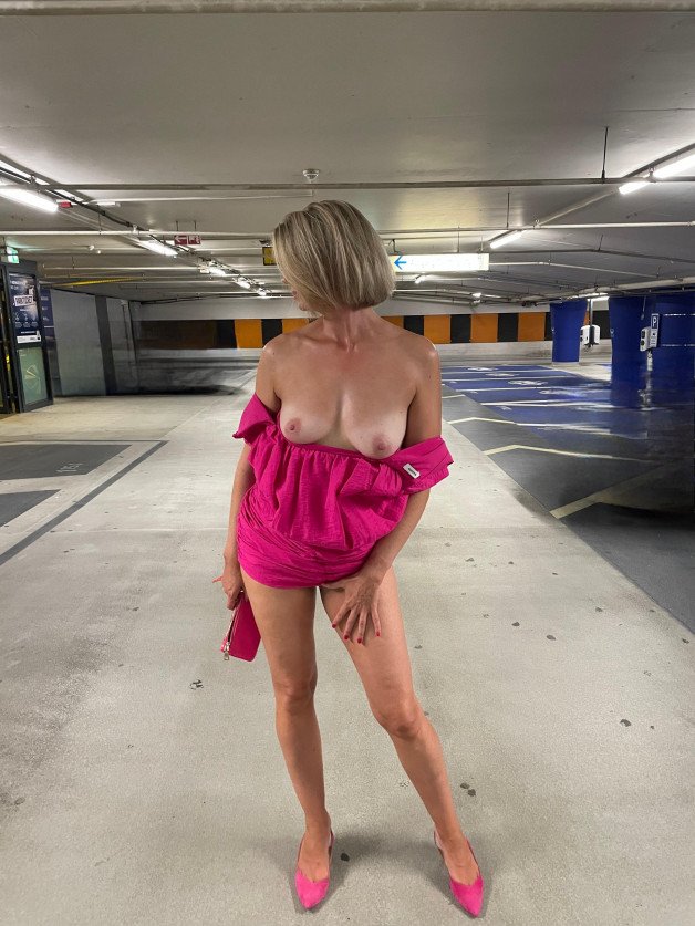 Album by happy.wife with the username @happy.wife, who is a verified user,  July 31, 2024 at 9:07 PM. The post is about the topic MILF and the text says 'Just a small hot garage   by my lover. Then I got into the car completely naked and we cruised through the night city. Then he bent me over the hood and fucked me through the hot summer night. What are your plans for an evening with me?'