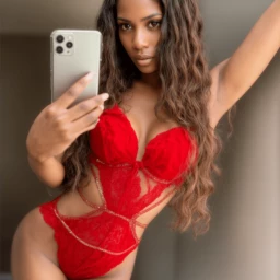 Photo by viviane.mk with the username @vivianemifoueni, who is a verified user,  April 18, 2024 at 11:55 PM. The post is about the topic Black Beauties and the text says 'Do you enjoy red lingerie?'