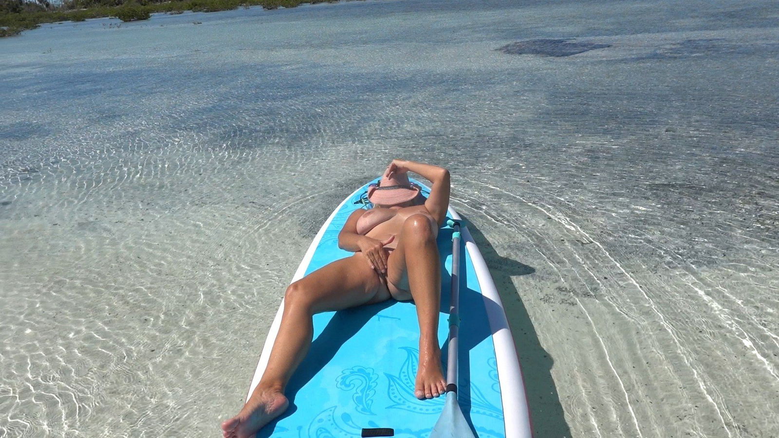 Photo by Sailing Angel with the username @sailingangelxxx, who is a verified user,  July 5, 2024 at 10:16 PM and the text says 'Out in a mangrove, naked on my paddleboard. Here&#039;s what I couldn&#039;t show in my OnDemand video SDA107N
Cum n play with me unlockd.me/sailingangel'