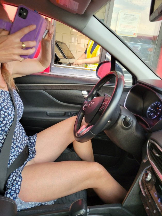Photo by NaughtyMILF4U with the username @NaughtyMILF4U, who is a verified user,  June 24, 2023 at 1:31 AM. The post is about the topic Adult Truth or Dare and the text says 'One of our friends set me on a dare.... a drive through with no panties and my pussy showing!'