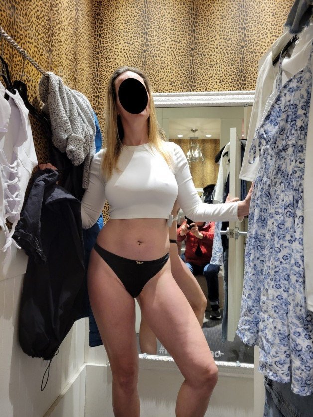 Photo by NaughtyMILF4U with the username @NaughtyMILF4U, who is a verified user,  July 9, 2023 at 8:00 PM. The post is about the topic Shopping and the text says 'I dislike shopping but there are ways to make it fun! Should I buy the shirt?'