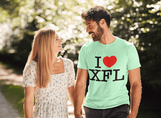 Photo by SharesomeLove with the username @SharesomeLove, who is a brand user,  March 21, 2023 at 12:08 PM. The post is about the topic SharesomeLove and the text says 'This I HEART XFL t-shirt is everything you've dreamed of and more. It feels soft and lightweight, with the right amount of stretch. It's comfortable and flattering for both men and women.

Get yours today:..'