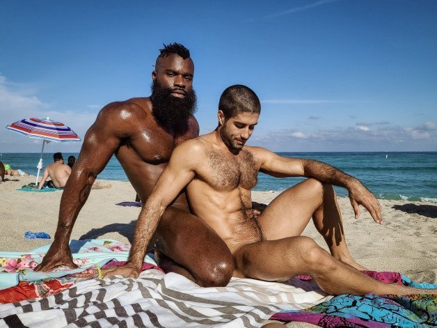 Photo by mike50667 with the username @mike50667, who is a verified user,  September 21, 2023 at 11:38 AM. The post is about the topic GoOutdoors and the text says '#goOutdoors, #couple, #naked, #interratial, #beach, #sand, #ocean,'