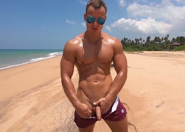 Photo by mike50667 with the username @mike50667, who is a verified user,  February 6, 2024 at 9:36 AM. The post is about the topic GoOutdoors and the text says '#goOutdoors #beach #ocean #sea #sand #shades #dick #cock #muscular #biceps #palm #tree'