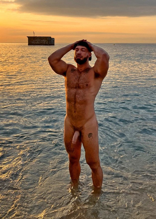 Photo by mike50667 with the username @mike50667, who is a verified user,  November 6, 2023 at 1:18 PM. The post is about the topic GoOutdoors and the text says '#goOutdoors, #beach, #ocean, #sun, #evening, #hairy, #dick, #cock, #beard, #pose,'