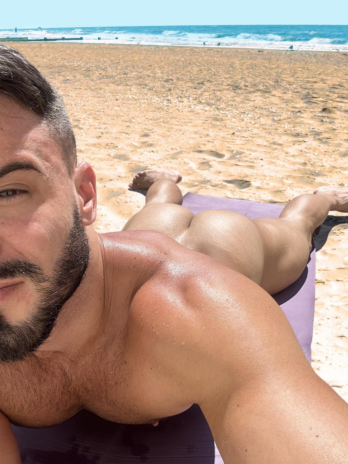 Photo by mike50667 with the username @mike50667, who is a verified user,  January 20, 2024 at 2:26 PM. The post is about the topic GoOutdoors and the text says '#goOutdoors, #beach, #ocean, #sand, #ass, #butt, #gay, #outdoors, #beard, #muscle, #muscular, #selfie, #nipple'