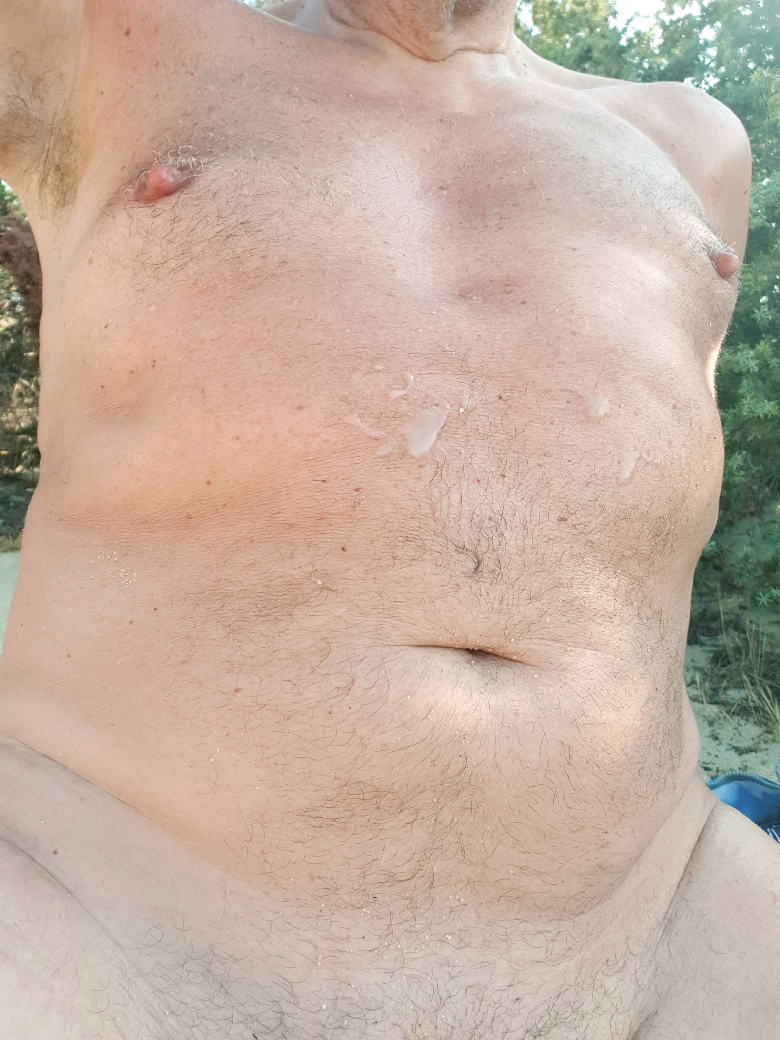 Photo by louparis10 with the username @louparis10, who is a verified user,  July 25, 2024 at 2:41 PM and the text says '#me #louparis10 #gay cruising behind the beach, one #daddy 💦 on my #torso while sitting on my #dick'