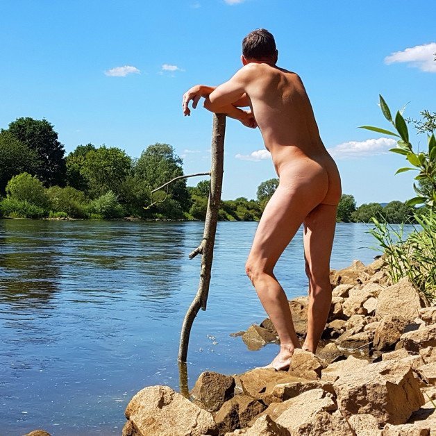 Photo by somethingz with the username @somethingz, who is a verified user,  March 2, 2024 at 2:44 PM. The post is about the topic Nudist4all and the text says '#outdoor #naked #ass #nudism #nude #lake #nudist #watch'