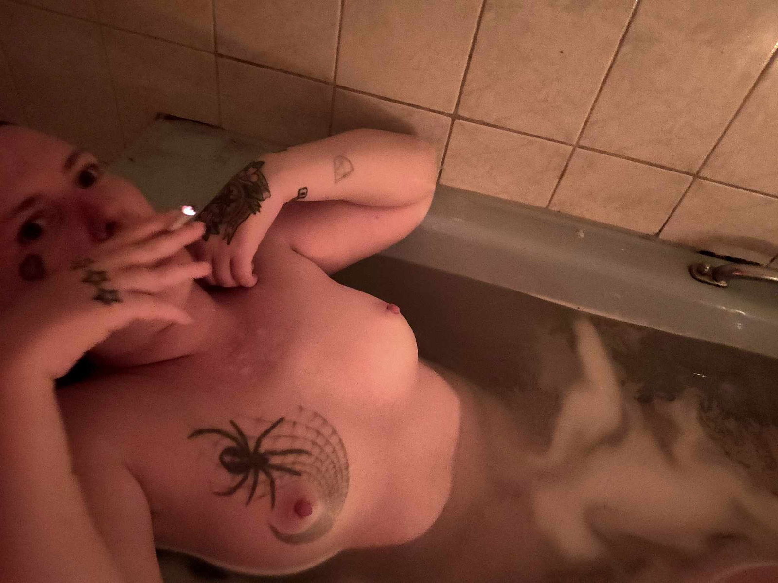 Album by DionysusZenunim with the username @DionysusZenunim, who is a star user,  September 24, 2023 at 6:00 PM. The post is about the topic Anarchist Punk Trans Man and the text says 'Kinky Queer Anarchist Punk Trans Man relaxing in a candlelit bath, listening to Folk Punk (Apes of the State to be specific) after a hard day causing trouble and fighting fascism!!!'