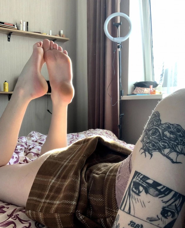 Photo by Milana.ts with the username @Milana11, who is a star user,  March 26, 2024 at 8:27 AM. The post is about the topic Foot Fetish and the text says 'When you look at my legs, what is the first thing that comes to your mind?'