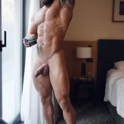 Shared Photo by Guytime331 with the username @Guytime331, who is a verified user,  April 5, 2024 at 10:13 PM and the text says 'Love standing naked in front of hotel windows'