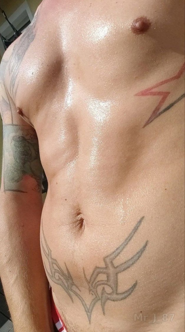 Photo by MrJ87 with the username @MrJ87, who is a verified user,  October 28, 2023 at 5:09 AM and the text says 'Wet look!  #summer #tattoos #sweat #hot'