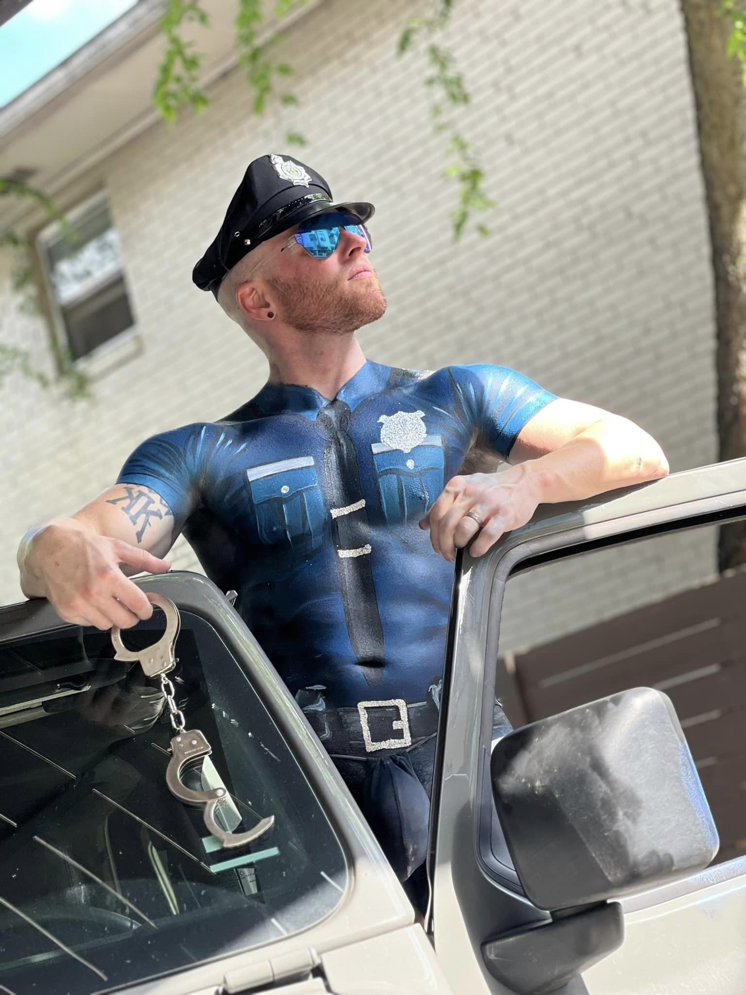 Photo by DirtyDaddyFunStuff with the username @DirtyDaddyPorn, who is a verified user,  May 5, 2024 at 6:00 PM and the text says 'Body Painted #cops #police #muscles  #ginger'