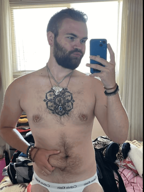 Album by DirtyDaddyFunStuff with the username @DirtyDaddyPorn, who is a verified user,  May 1, 2024 at 11:19 PM and the text says 'Hot fun #wrestling #muscles #hairy'