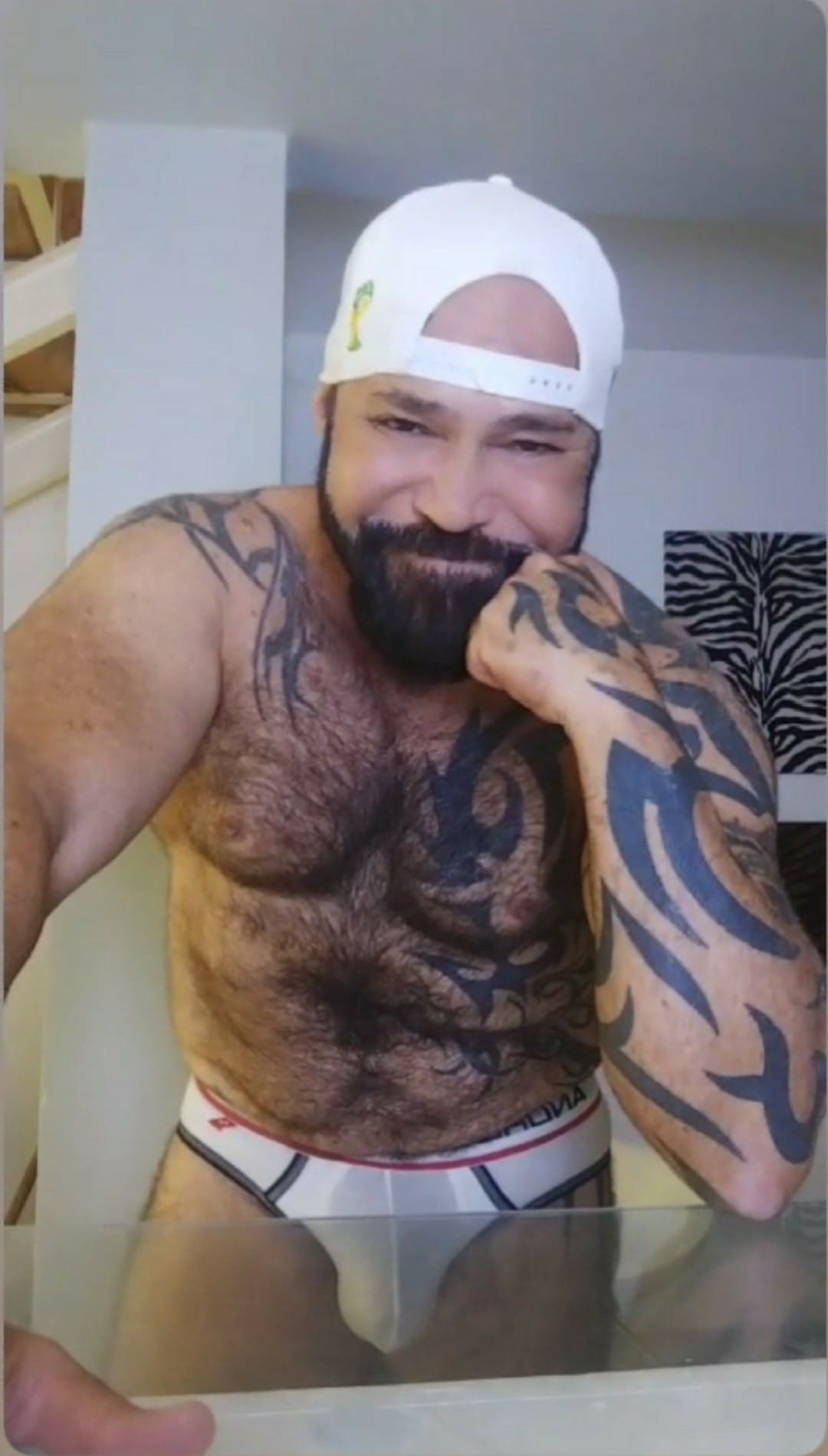Photo by DirtyDaddyFunStuff with the username @DirtyDaddyPorn, who is a verified user,  March 5, 2024 at 12:19 AM and the text says 'Sheer Shorts and #tats #bear .  #hairy #beards #armpits #stocky'
