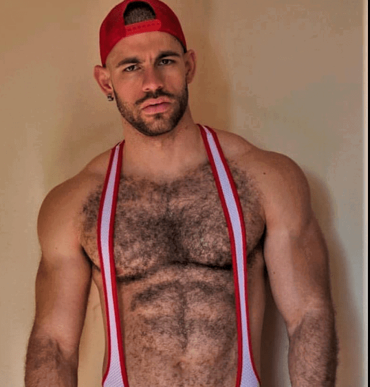 Album by DirtyDaddyFunStuff with the username @DirtyDaddyPorn, who is a verified user,  May 1, 2024 at 11:19 PM and the text says 'Hot fun #wrestling #muscles #hairy'