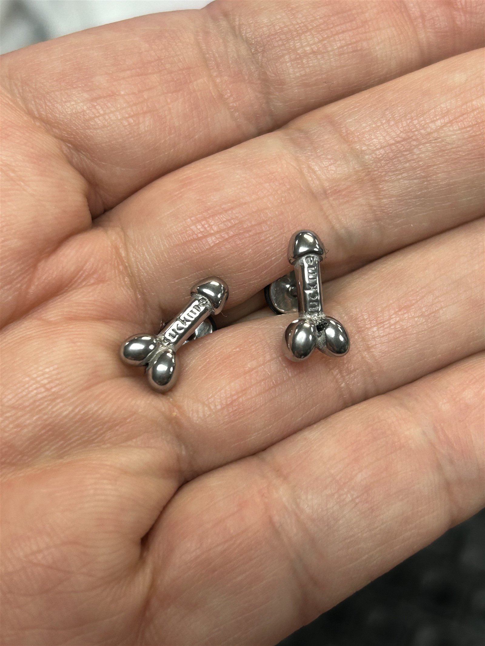 Photo by DirtyDaddyFunStuff with the username @DirtyDaddyPorn, who is a verified user,  February 15, 2024 at 10:32 PM and the text says 'https://whozitzandwhatzitz.com/products/suck-me-penis-earrings
Our fun little Gay Owned Shop has #penis #suckme #earrings  . Gold Steel, Black Steel or Silver Steel.  #cock #cocklovers #oral'