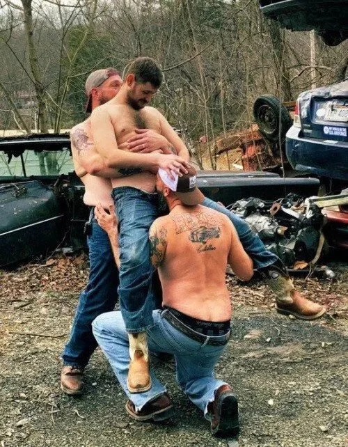 Photo by DirtyDaddyFunStuff with the username @DirtyDaddyPorn, who is a verified user,  April 10, 2024 at 10:23 PM and the text says '#redneck #threesome #tats #outdoors'