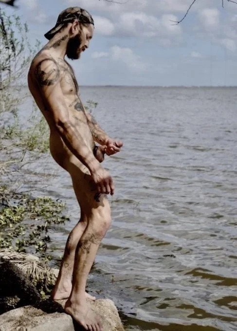 Photo by DirtyDaddyFunStuff with the username @DirtyDaddyPorn, who is a verified user,  April 13, 2024 at 7:14 PM and the text says 'Lake God.  #jackingoff #hung #tats #hairy #muscles #otter'