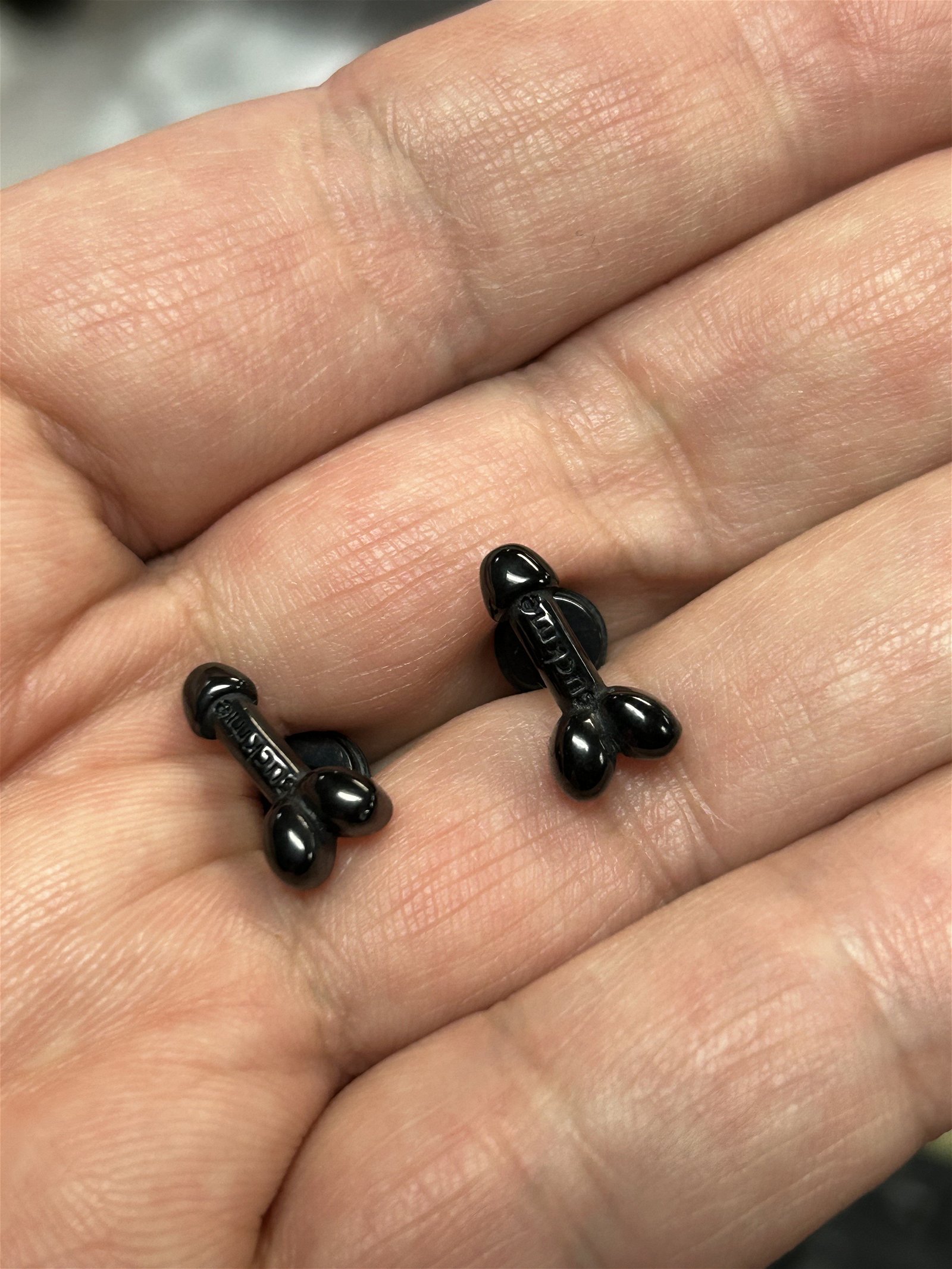 Photo by DirtyDaddyFunStuff with the username @DirtyDaddyPorn, who is a verified user,  February 15, 2024 at 10:32 PM and the text says 'https://whozitzandwhatzitz.com/products/suck-me-penis-earrings
Our fun little Gay Owned Shop has #penis #suckme #earrings  . Gold Steel, Black Steel or Silver Steel.  #cock #cocklovers #oral'