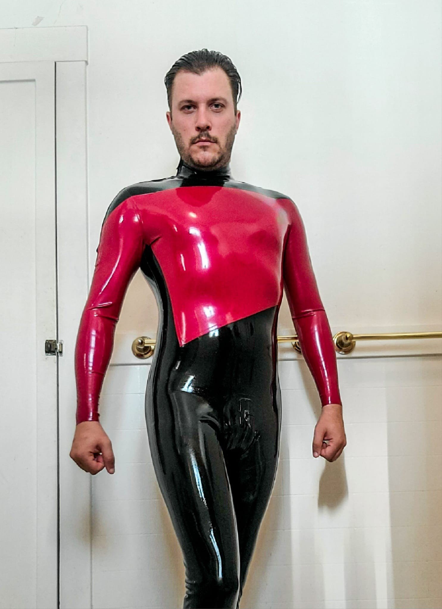 Photo by DirtyDaddyFunStuff with the username @DirtyDaddyPorn, who is a verified user,  April 22, 2024 at 8:07 PM and the text says '#rubber man #uniform #startrek #kink'