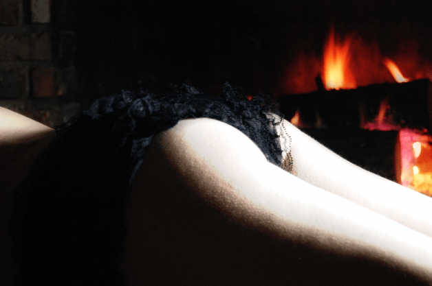 Photo by Kenley & Erik with the username @KenleyandErik, who is a verified user,  December 22, 2023 at 4:35 AM and the text says 'A little tease by the fire. 🔥

share me/use me/tribute me 😈

#ass #milf #fuckmeeyes #tits #tributeme #naughty'
